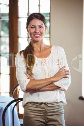 Woman standing with arms crossed