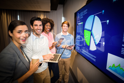 Portrait of business people standing in the conference room