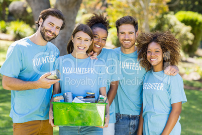 Portrait of volunteer group holding box