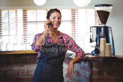 Waitress making a phone call