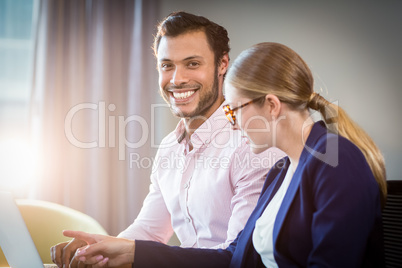 Businesswoman interacting with a colleague