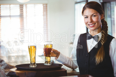 Waitress holding a beer