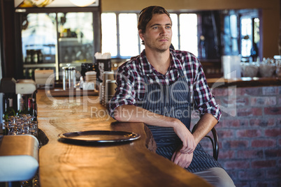 Waiter sitting on a chair