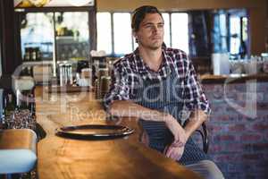 Waiter sitting on a chair