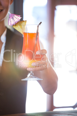 Waitress handing over cocktails