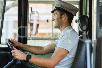 Bus driver driving a bus