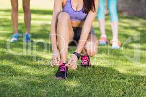 Woman tying shoe lace