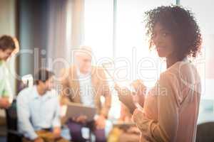 Businesswoman holding digital tablet