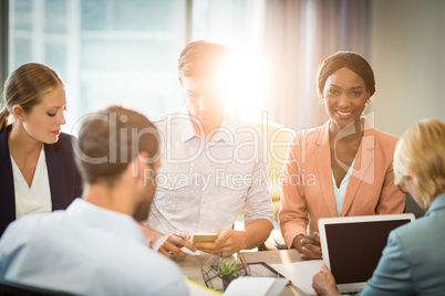 Group of business people discussing at desk