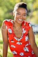 Happy woman sitting in park