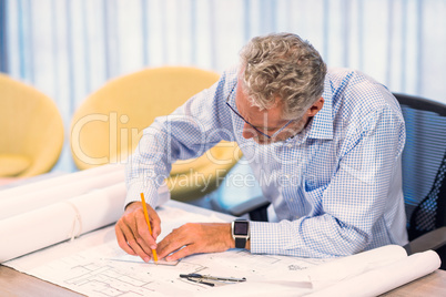 Man working on blueprint
