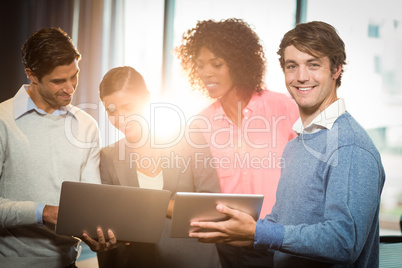 Business people having discussion over digital tablet