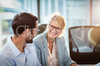 Businesswoman interacting with a colleague