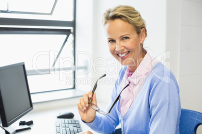 Portrait of teacher smiling in classroom