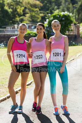 Female athletes standing in park
