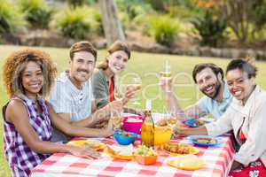 Friends having wine with breakfast