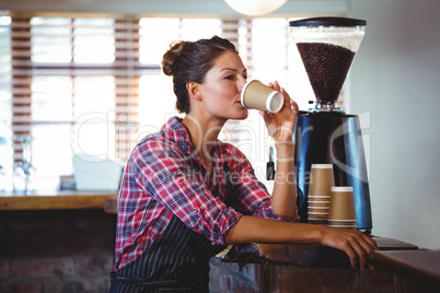 Waitress drinking a coffee