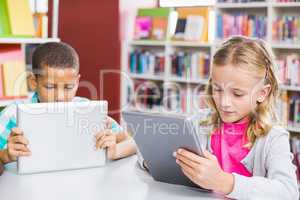 Kids using digital tablet in library