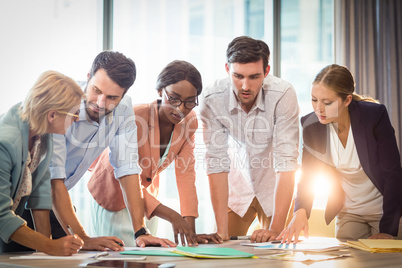 Group of business people discussing at desk