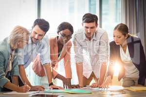 Group of business people discussing at desk