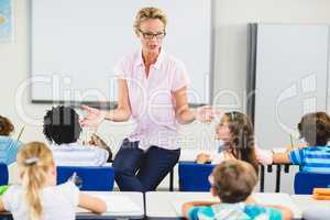 Teacher teaching kids in classroom