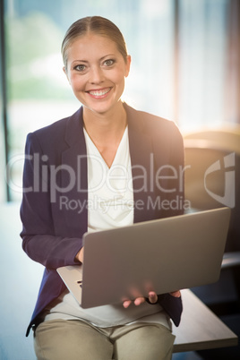 Businesswoman using laptop