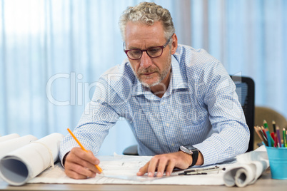 Man working on blueprint