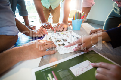 Business people discussing over graph during a meeting