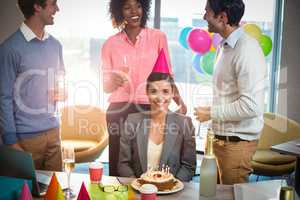 Business people celebrating birthday