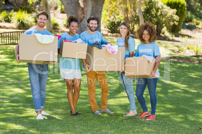 Group of volunteer holding cartons