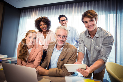 Portrait of business people smiling while having discussion over