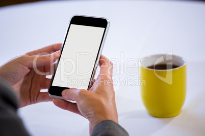 Woman taking a picture of coffee