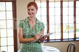 Woman holding a clipboard