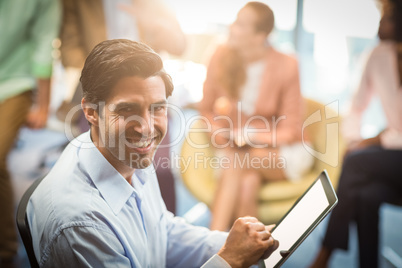 Businessman holding digital tablet