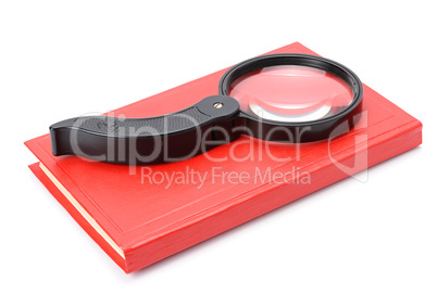 book and magnifying glass isolated on white