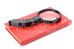 book and magnifying glass isolated on white