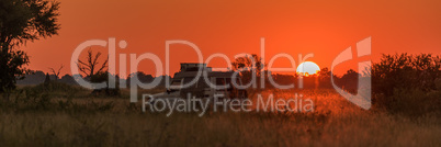 Panorama of jeep driving home at sunset