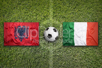 Albania vs. Italy flags on soccer field