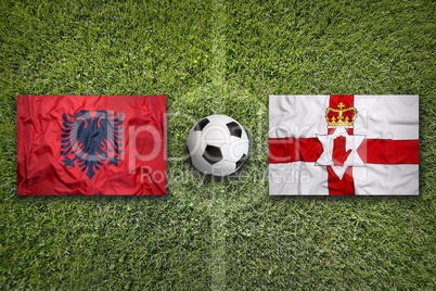Albania vs. Northern Ireland flags on soccer field