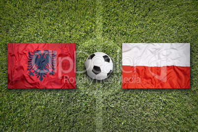 Albania vs. Poland flags on soccer field
