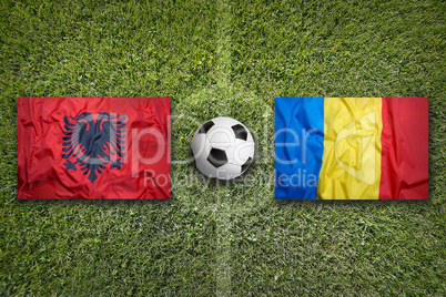 Albania vs. Romania flags on soccer field