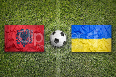Albania vs. Ukraine flags on soccer field