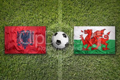 Albania vs. Wales flags on soccer field