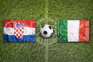 Croatia vs. Italy flags on soccer field