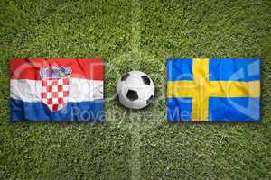 Croatia vs. Sweden flags on soccer field