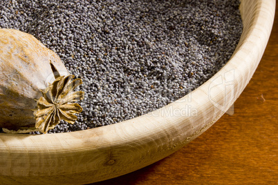 Poppy seeds in a wooden bowl