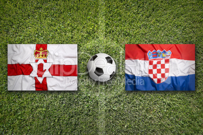Northern Ireland vs. Croatia flags on soccer field