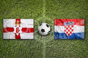 Northern Ireland vs. Croatia flags on soccer field