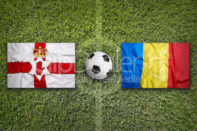Northern Ireland vs. Romania flags on soccer field