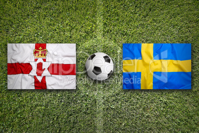 Northern Ireland vs. Sweden flags on soccer field